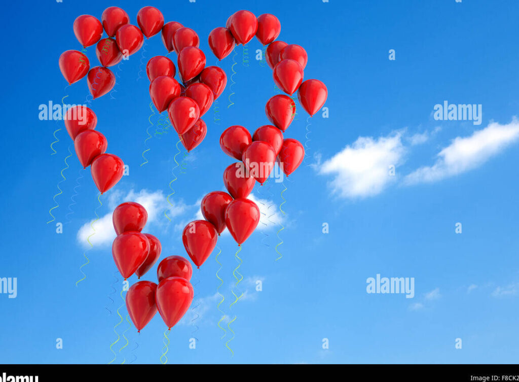 una imagen de un cielo despejado con globos en forma de corazon volando hacia arriba