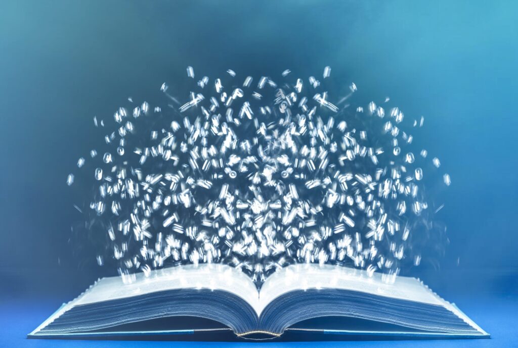 una imagen de un libro abierto con figuras magicas saliendo de sus paginas