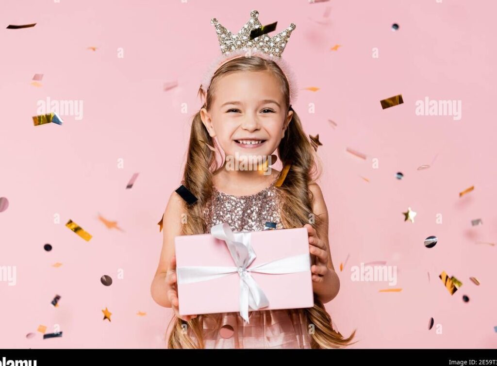 una imagen de una nina con una corona de princesa rodeada de regalos y decoraciones festivas